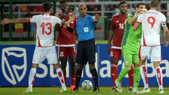 Image showing the aftermath of the most controversial referee decisions in Africa, featuring scenes of disputed penalty calls, biased refereeing in African tournaments, worst referee calls in African football, and African football officiating controversies. Focus on key incidents in Africa Cup and CAF Champions League referee scandals.